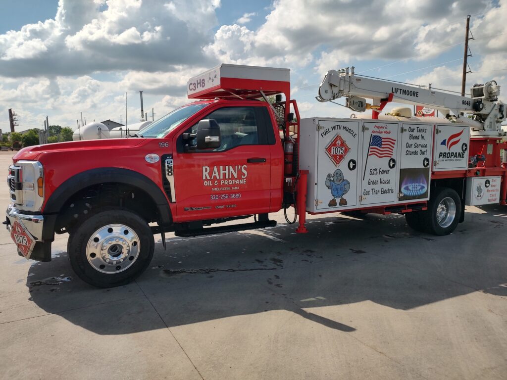Rahn's Oil & Propane utility truck covered in logos and signage to be used in the summer parades