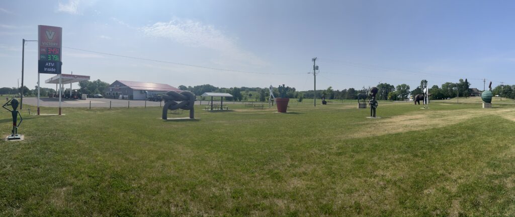 View of Nyberg Sculpture Garden looking toward Big Foot Gas & Grocery C-store across the street